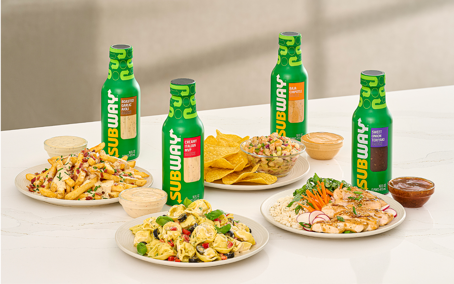 Four Subway sauce bottles with recipes 